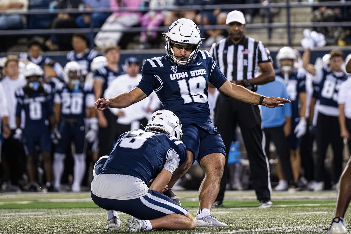 Kian Afrookhteh, kicker, kicking for Utah State