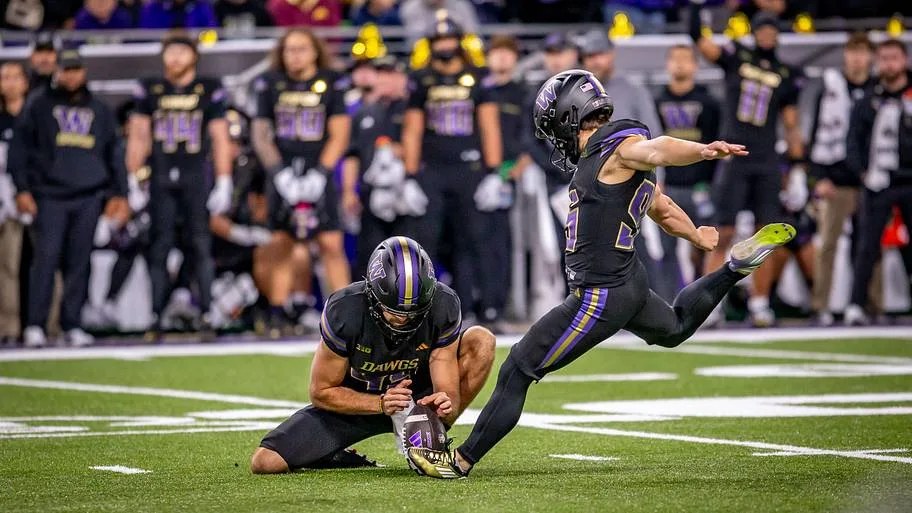 Tyler Robles, kicker, kicking a field goal for Washington